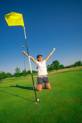 attractive-young-woman-playing-golf