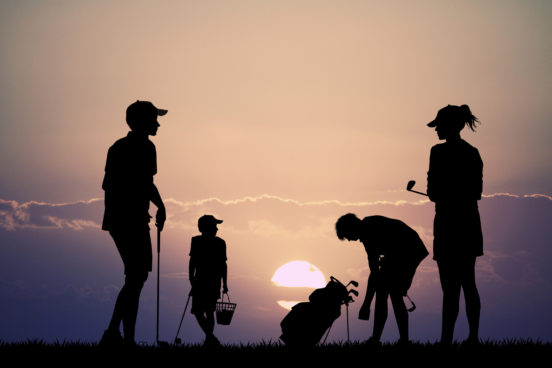 family plays golf
